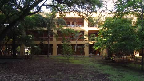 A-Smooth-Entrance-Shot-Of-A-Yellow-Christian-University-Campus-in-Argentina