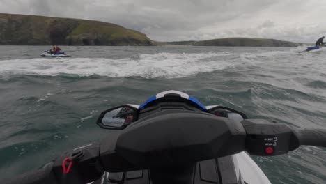 POV-shot-of-a-jet-ski-instructor-speaking-with-the-jet-ski-group-whilst-resting-at-Newquay