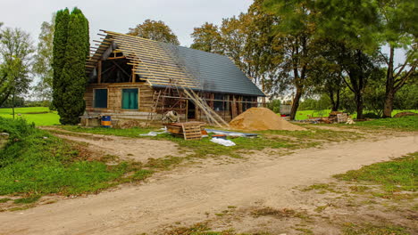 One-year-time-lapse-of-renovating-wooden-rural-house,-four-season