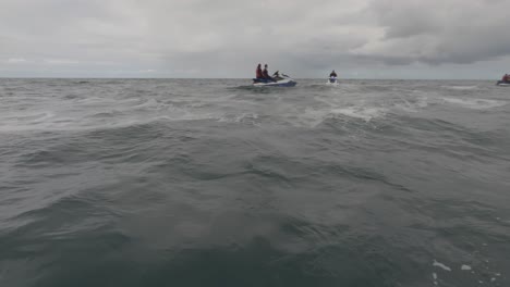 POV-shot-of-a-jet-ski-group-resting-together-taking-photos-off-the-coast-of-Newquay