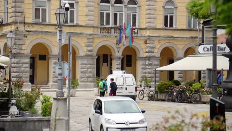 Tourists-and-vehicles-in-the-town-centre-of-Labin,-Istria-County,-Croatia