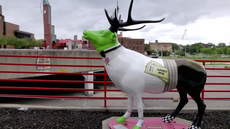 Elk-statue-in-downtown-Elkhart,-Indiana-with-gimbal-video-walking-around
