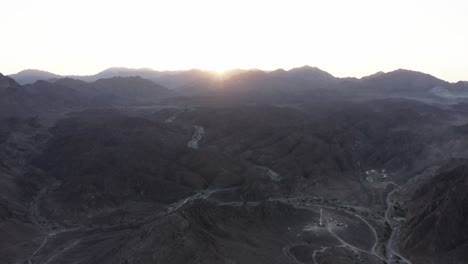 Epic-sunrise:-Aerial-view-of-Wadi-Shawka-mountains,-Ras-Al-Khaimah