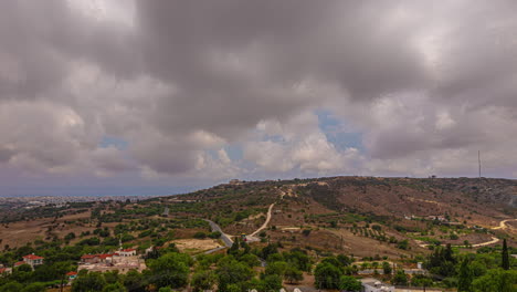 Storm-clouds-gather-grey-and-dark-above-european-middle-east-hill-town