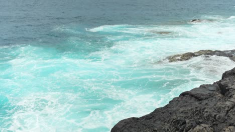 Powerful-ocean-waves-hitting-Tenerife-coastline,-slow-motion-view