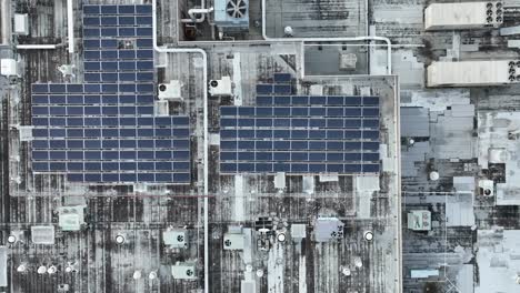 Industrial-rooftop-with-solar-panels-and-ventilation-units-for-heating-and-cooling