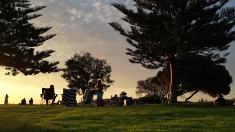 People-relax-at-a-beautiful-sunset-in-Fremantle-Park-in-Australia