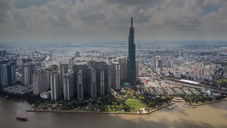 Dramatic-aerial-day-hyperlapse-or-aerial-time-lapse-view-of-landmark-building-and-surrounds,-Saigon-River,-Ho-Chi-Minh-City,-Vietnam