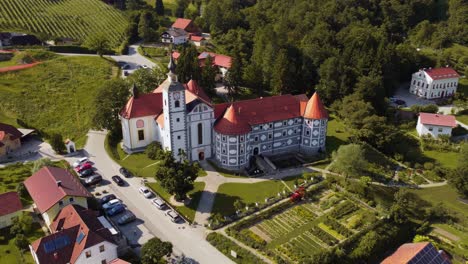 Aerial-view-showing-historical-castle-in-Olimje-City-during-sunny-day,-Slovenia
