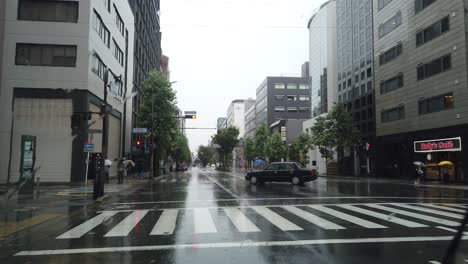 Inside-Car-View-Streets-of-Central-Kyoto-Under-Typhoon-Rain-on-Emergency-Warning