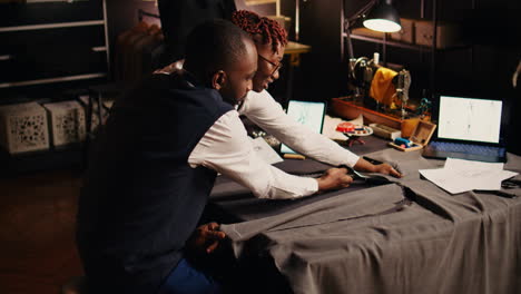 African-american-tailors-cutting-garment