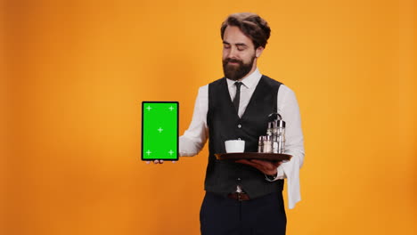 Staff-presents-tablet-with-greenscreen