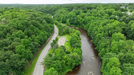 Aerial-view-of-the-Penobscot-River-flowing-through-Bangor,-Maine's-countryside