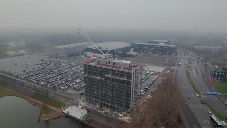 Building-the-Hotel-Ibis-with-Rotterdam-AHOY-in-the-Backdrop,-Netherlands