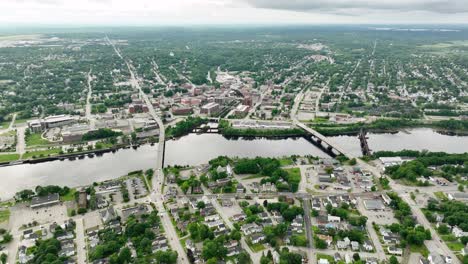 Wide-drone-shot-of-Bangor,-Maine-with-the-Penobscot-River-cutting-through-the-city