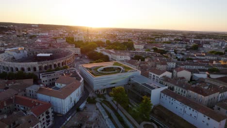 Aerial-over-The-Musée-de-la-Romanité,-captivating-testament-to-the-rich-history-of-Roman-civilization-in-Nîmes,-France