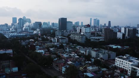 Mexico-city-skyline-on-moody-cloudy-day,-aerial-view