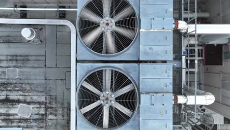 Spinning-shot-of-air-conditioning-utility-unit-on-roof-of-industrial-building