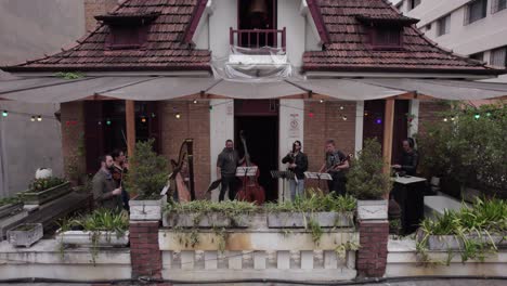 Jazz-Septet-Band-Plays-Music-On-Bar-Balcony-In-Sao-Paulo,-Brazil