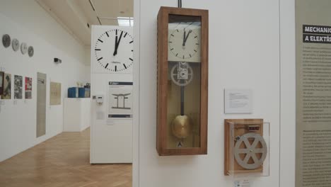 clock-exhibition-Inside-National-Technical-Museum-in-Prague,-Czech-Republic,-featuring-a-collection-of-timepieces-from-various-eras-and-styles