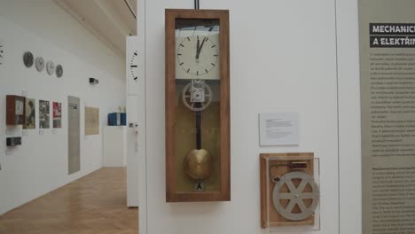 clock-display-Inside-National-Technical-Museum-in-Prague,-Czech-Republic,-featuring-a-collection-of-timepieces-from-various-eras-and-styles