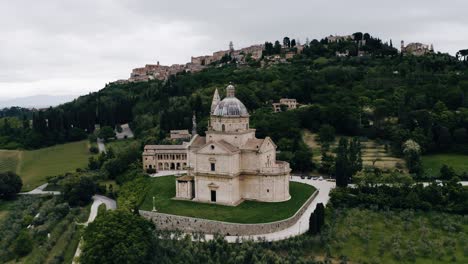 Drone-shot-of-Sanctuary-of-the-Madonna-di-San-Biagio-in-Italy's-green-countryside