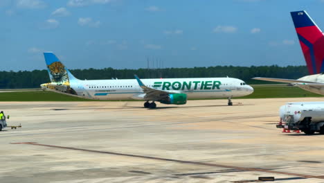 Passenger-jet-turning-around-on-runway-before-taxing-for-takeoff,-Frontier-Airlines