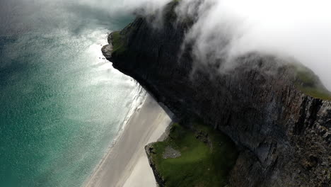 Drone-footage-of-rocky-coastline-at-the-island-of-Vaeroy,-Lofoten-Islands-in-Norway
