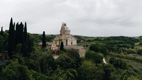 Drone-shot-flying-by-the-Sanctuary-of-the-Madonna-di-San-Biagio-in-Italy's-countryside