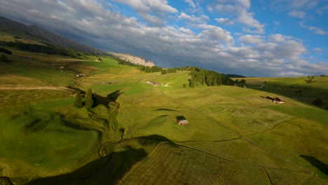 FPV-drone-shot-flying-over-high-altitude-plateau-of-Alpe-di-Suisi-located-in-the-Dolomites
