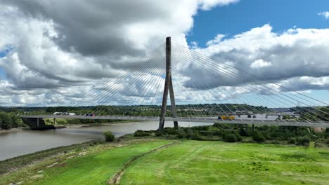 Establishing-shot-of-a-toll-bridge-over-the-river-Suir-in-Waterford-Ireland-on-a-warm-sunny-day