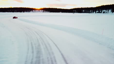 Sports-car-is-driving-on-a-frozen-lake-in-the-arctic-circle