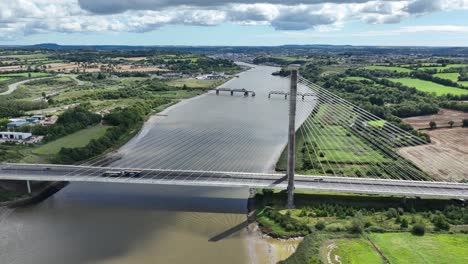 establishing-shot-of-traffic-crossing-a-new-bridge-over-The-River-Suir-Waterford-Ireland-on-a-summer-day