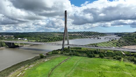 Two-bridges-modern-and-old-disused-bridge-in-the-background-in-Waterford-Ireland-on-a-bright-summer-day