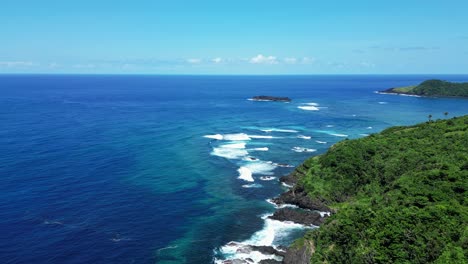 Panoramic-aerial-above-crashing-waves-on-outside-point-break-on-baras-catanduanes-coastline