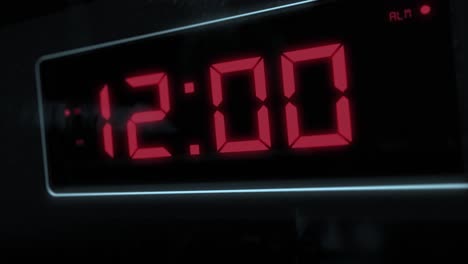 High-quality-CGI-render-of-a-digital-alarm-clock,-with-glowing-red-numbers,-ticking-over-from-11