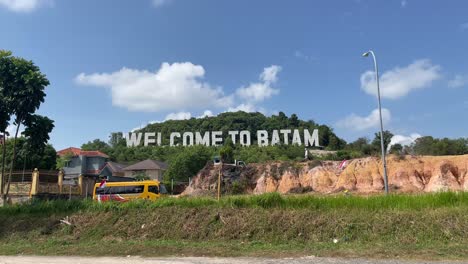 Iconic-sign-on-a-hillside,-famous-for-photo-ops-of-the-Welcome-To-Batam-Monument,-Indonesia