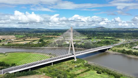 Drone-flying-towards-suspension-bridge-in-Waterford-Ireland-on-a-summer-day