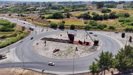Static-drone-shot-of-a-roundabout-with-a-monument-in
