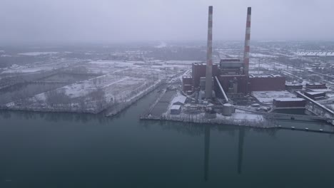 Closed-coal-power-plant-on-cold-and-moody-winter-day,-aerial-drone-view
