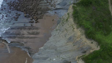 Top-view-of-sheer-cliff-rocks-and-unique-geology-of-itzurun-zumaia-spain