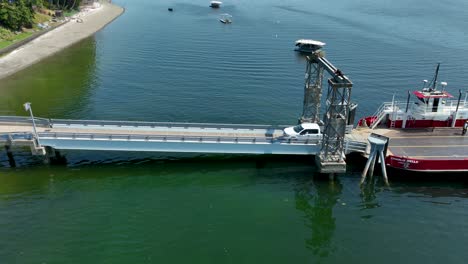 Aerial-view-of-a-white-truck-departing-the-Herron-Island-ferry
