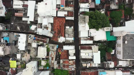 Aerial-drone-camera-moving-from-Para-Bazar-Street-Market-in-Rajkot-to-Raya-Naka-Tower-Aerial-top-down-view