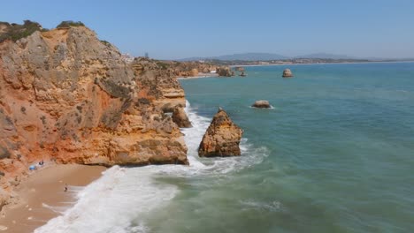 Aerial-dolly,-Ponta-da-Peidade-and-Praia-da-Dona-Ana,-rocky-coastline-of-Algarve