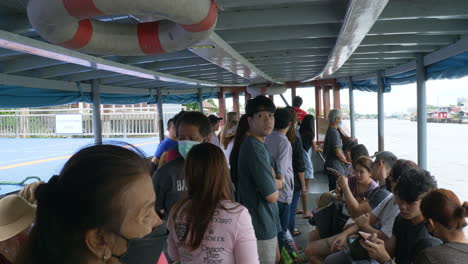 Boat-ship-ferry-transportation-send-receive-passenger-travelers-people-crossing-chao-phraya-river-between-Pak-kret-city-and-Ko-Kret-small-island-in-Thailand