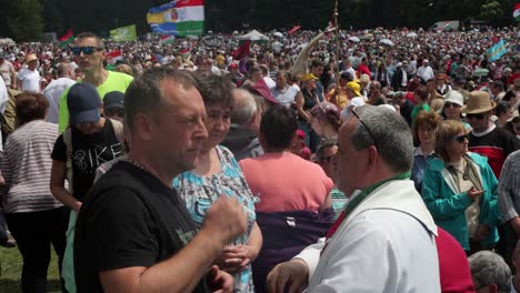 Priest-serves-Holy-Communion-to-Catholics-at-Csiksomlyo-Pilgrimage,-Romania