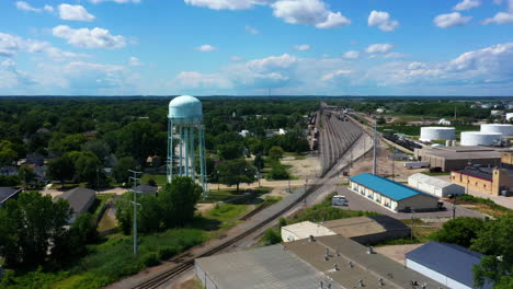 Aerial-view-toward-the-water-tower,-sunny,-summer-day-in-Greenbay,-USA