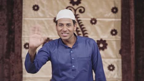 Indian-muslim-man-saying-hello-to-the-camera