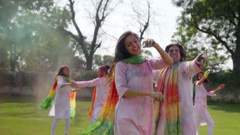 Indian-couple-dancing-at-a-holi-party