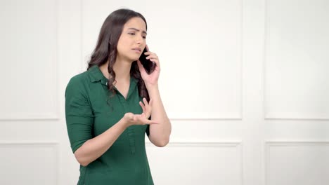 Frustrated-Indian-girl-talking-on-call